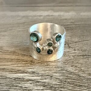 Elegant Silver Ring with Green Accents